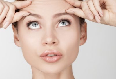 woman doing face massage