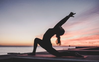 stretching at sunset